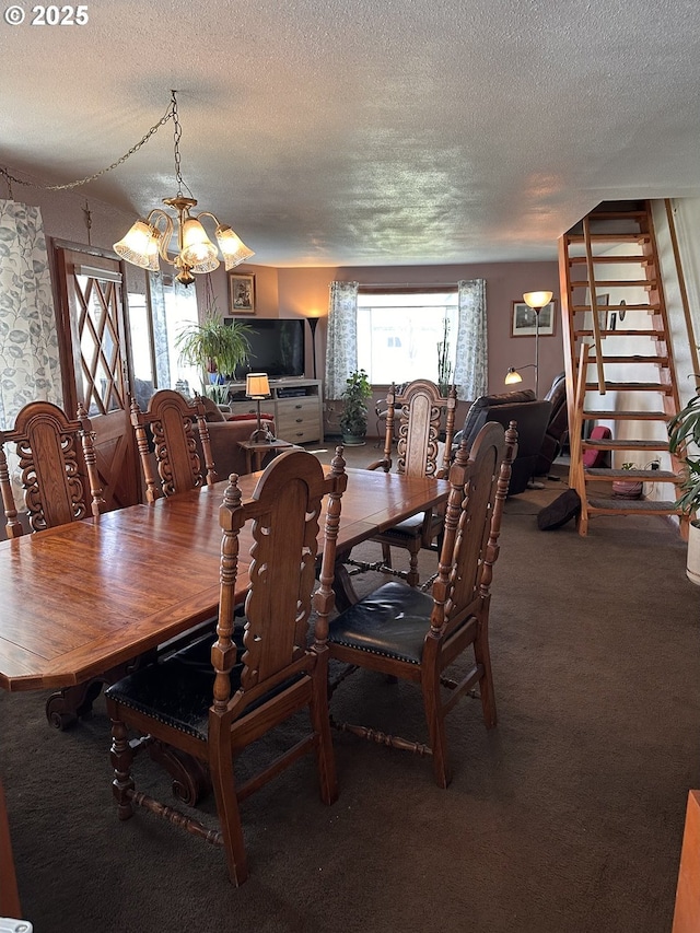 309 E Van Buren St, Athena, OR 97813 - dining room with a textured ceiling, a chandelier, and carpet flooring