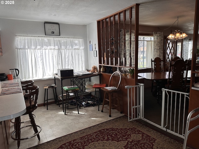 309 E Van Buren St, Athena, OR 97813 - dining room featuring a textured ceiling, a chandelier, and tile patterned floors