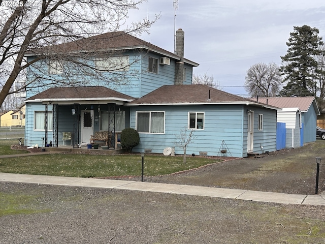 309 E Van Buren St, Athena, OR 97813 - view of front of property featuring a chimney, a front yard, and a porch