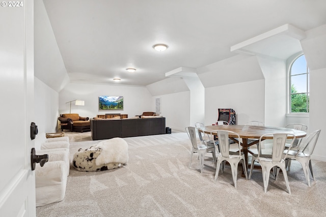 interior space featuring lofted ceiling and carpet flooring