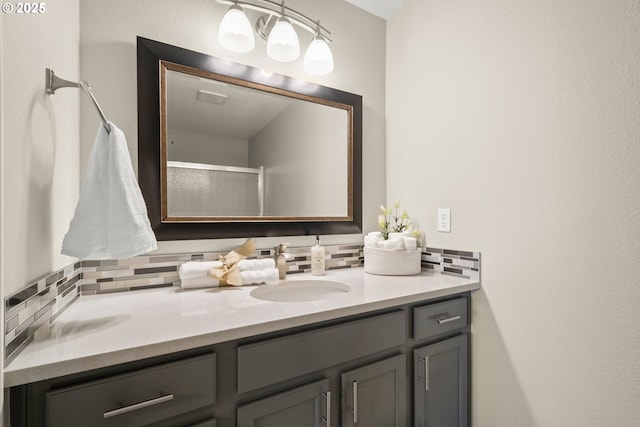 bathroom featuring tasteful backsplash and vanity