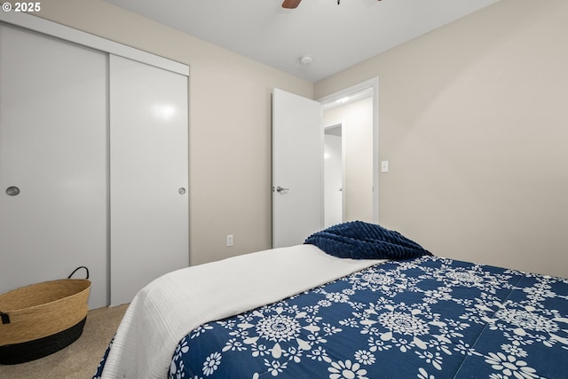 bedroom with a closet, ceiling fan, and carpet