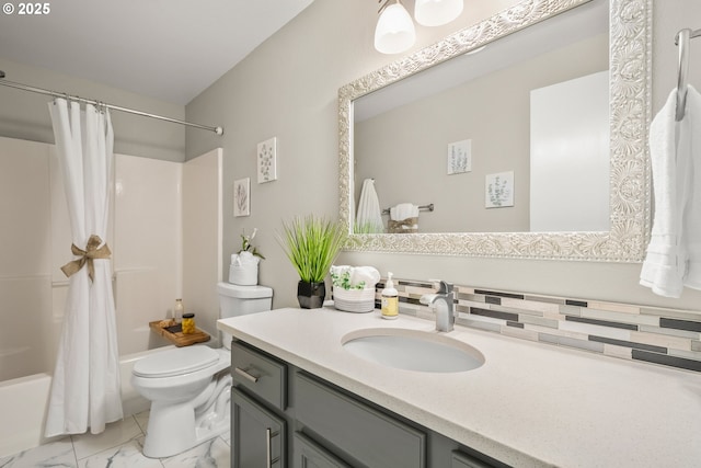 full bathroom with shower / bath combo, vanity, and toilet