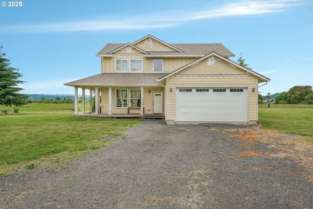 18385 Inglis Rd, Clatskanie, OR 97016 - view of front facade with driveway, a front lawn, a garage, covered porch, and roof with shingles