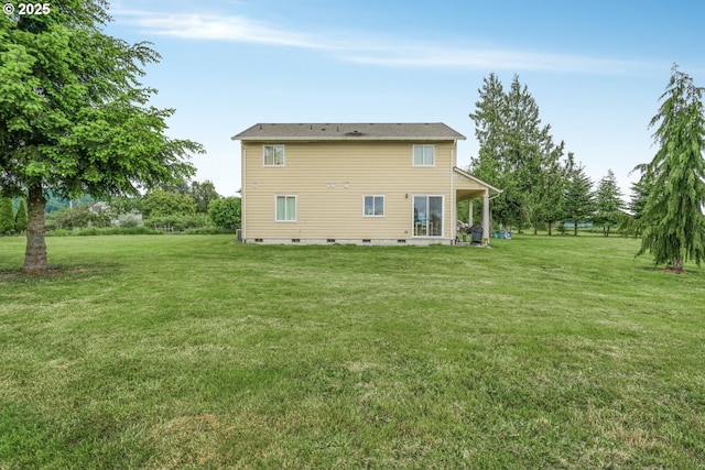 18385 Inglis Rd, Clatskanie, OR 97016 - back of house featuring a lawn and crawl space