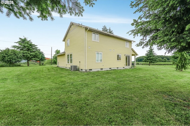 18385 Inglis Rd, Clatskanie, OR 97016 - rear view of house featuring central AC, a lawn, and crawl space