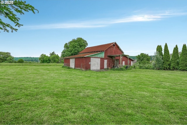 18385 Inglis Rd, Clatskanie, OR 97016 - view of green lawn with a barn and an outbuilding