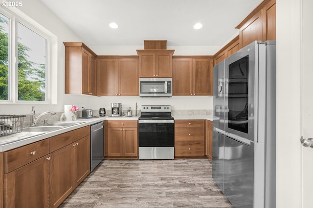 18385 Inglis Rd, Clatskanie, OR 97016 - kitchen featuring stainless steel appliances, healthy amount of natural light, light countertops, light wood-style flooring, and recessed lighting