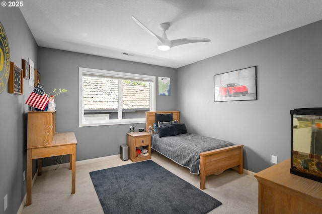 bedroom with carpet floors, baseboards, and a ceiling fan