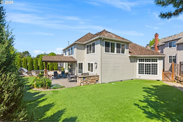rear view of property featuring a patio area, a gate, crawl space, and a chimney