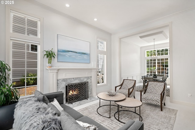 living room featuring a fireplace and recessed lighting