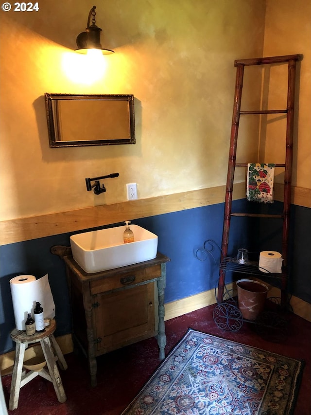 bathroom with vanity and baseboards