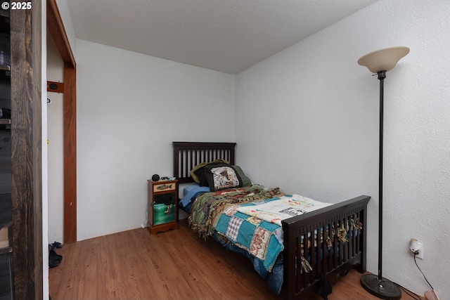 bedroom featuring hardwood / wood-style floors