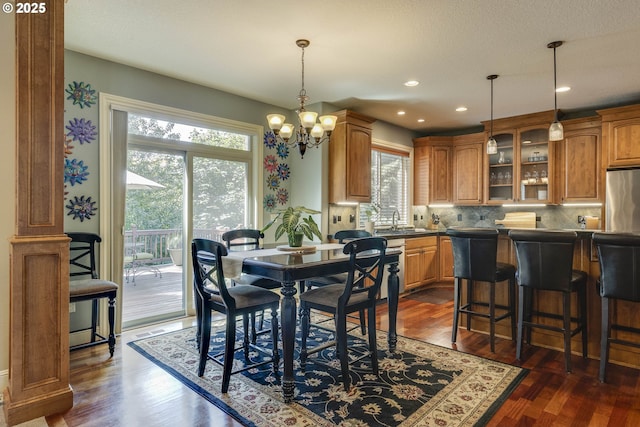 16572 SE Oak Meadow Ct, Damascus, OR 97089 - dining space featuring dark wood-style flooring, a chandelier, and recessed lighting