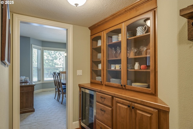 16572 SE Oak Meadow Ct, Damascus, OR 97089 - bar featuring wine cooler, carpet flooring, and a textured ceiling