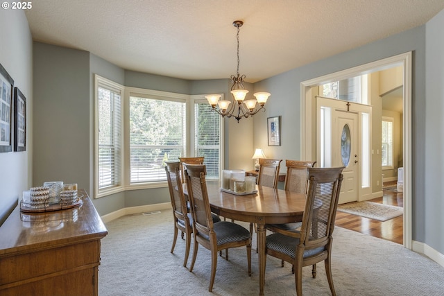 16572 SE Oak Meadow Ct, Damascus, OR 97089 - dining space with light colored carpet and a chandelier