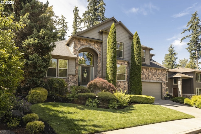 16572 SE Oak Meadow Ct, Damascus, OR 97089 - view of front facade featuring stone siding, concrete driveway, a front yard, and an attached garage