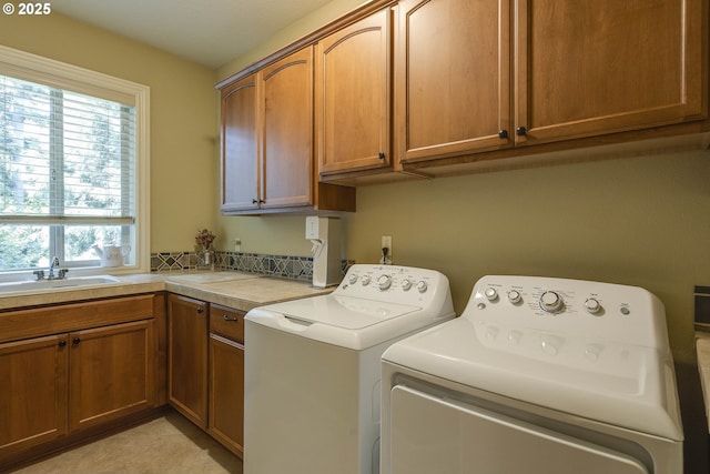 16572 SE Oak Meadow Ct, Damascus, OR 97089 - laundry room featuring cabinet space, washing machine and dryer, and plenty of natural light