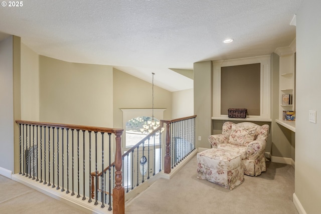16572 SE Oak Meadow Ct, Damascus, OR 97089 - living area with carpet floors, a chandelier, a textured ceiling, an upstairs landing, and recessed lighting