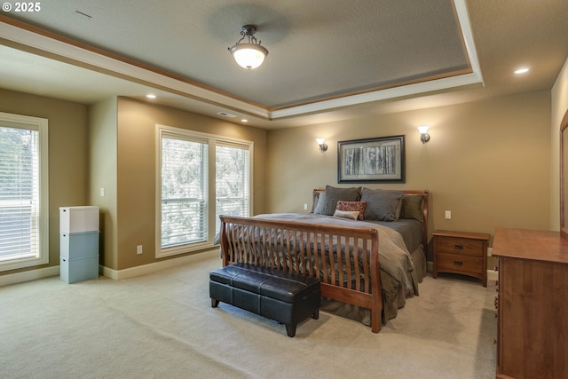 16572 SE Oak Meadow Ct, Damascus, OR 97089 - bedroom featuring light carpet, multiple windows, a raised ceiling, and recessed lighting