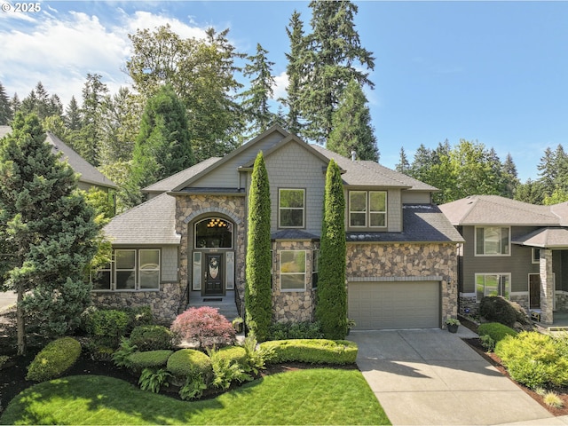 16572 SE Oak Meadow Ct, Damascus, OR 97089 - view of front of house with stone siding, driveway, and a garage