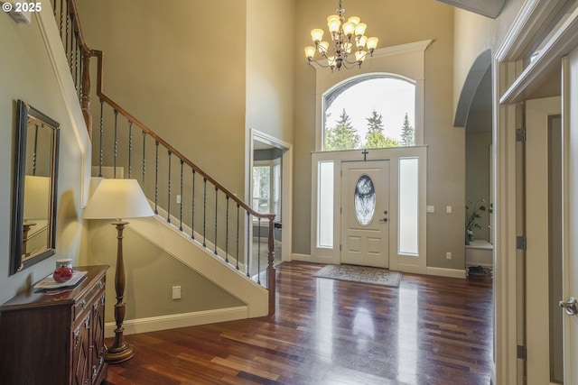 16572 SE Oak Meadow Ct, Damascus, OR 97089 - foyer entrance featuring a high ceiling, a chandelier, wood finished floors, and stairway