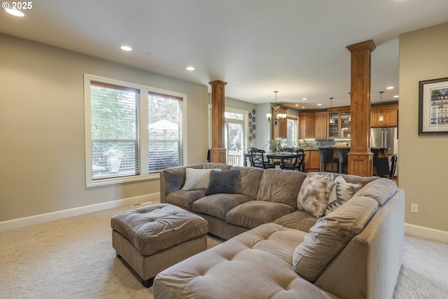 16572 SE Oak Meadow Ct, Damascus, OR 97089 - living area featuring ornate columns, recessed lighting, light colored carpet, and a chandelier