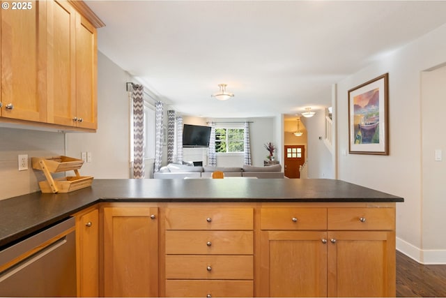 511 NE Skidmore St, Portland, OR 97211 - kitchen featuring stainless steel dishwasher, a peninsula, dark wood finished floors, dark countertops, and open floor plan