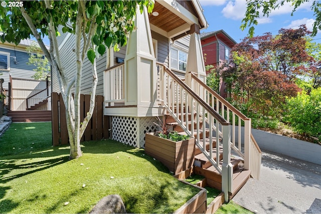 511 NE Skidmore St, Portland, OR 97211 - view of side of home featuring a yard and stairs