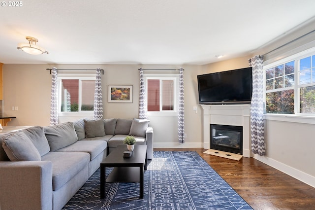 511 NE Skidmore St, Portland, OR 97211 - living room featuring wood finished floors and a fireplace with flush hearth
