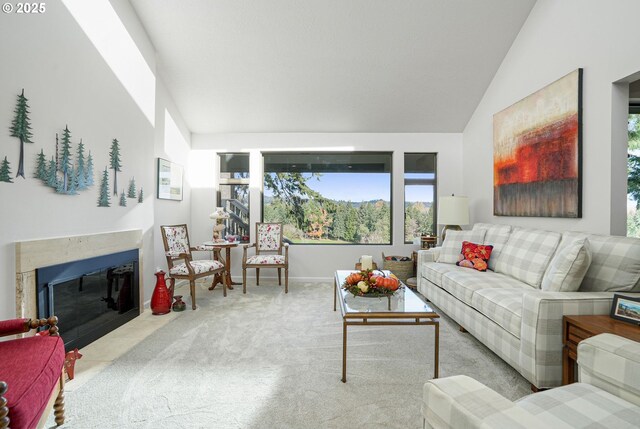 sitting room with vaulted ceiling and light carpet