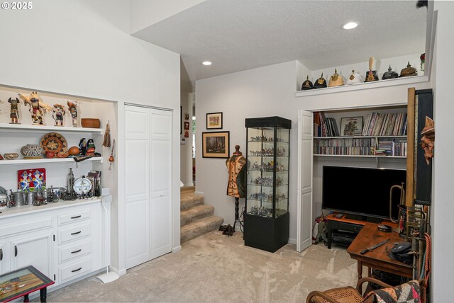 living room featuring a towering ceiling and built in shelves