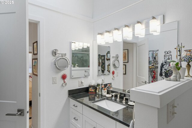 bedroom with a high ceiling, ensuite bathroom, and beam ceiling