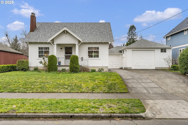 view of front of property with a front lawn, roof with shingles, a chimney, a garage, and driveway