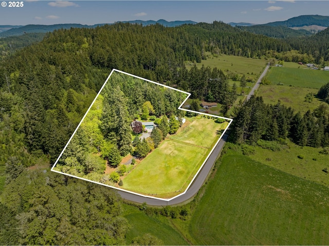 38383 Cartwright Creek Rd, Marcola, OR 97454 - aerial overview of property's location featuring a heavily wooded area, property boundaries highlighted, and a mountain backdrop