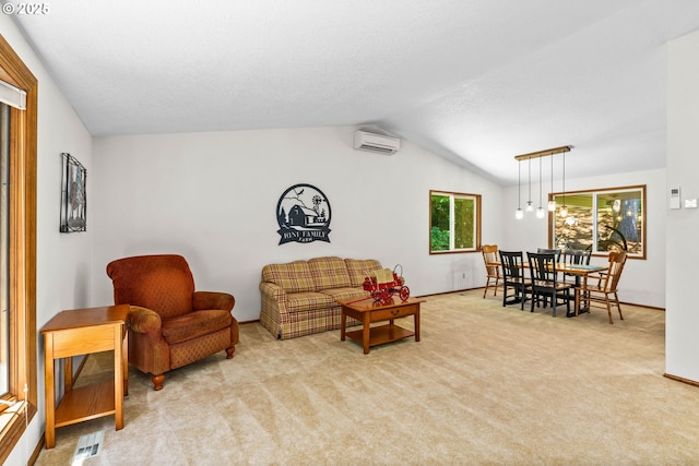 38383 Cartwright Creek Rd, Marcola, OR 97454 - living area featuring a wall mounted air conditioner, carpet flooring, baseboards, and lofted ceiling