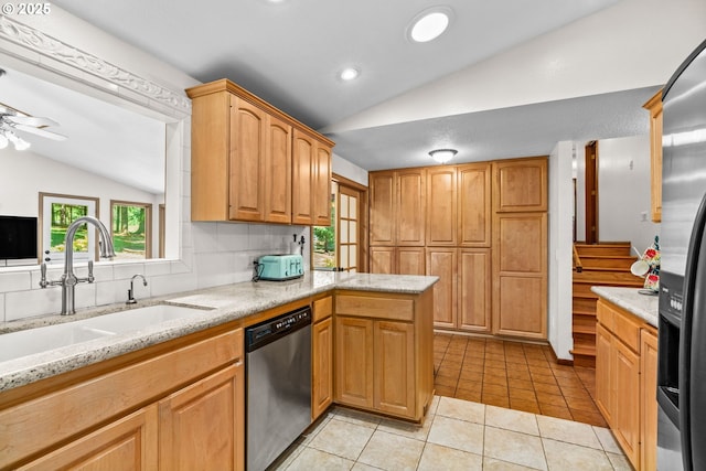 38383 Cartwright Creek Rd, Marcola, OR 97454 - kitchen with appliances with stainless steel finishes, lofted ceiling, a sink, a ceiling fan, and light tile patterned floors