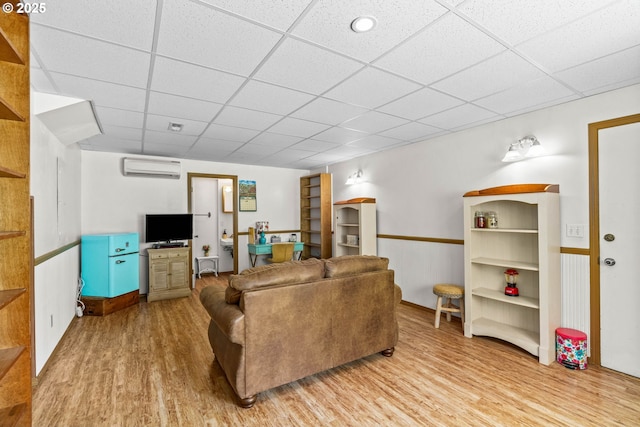 38383 Cartwright Creek Rd, Marcola, OR 97454 - living area with a paneled ceiling, light wood-type flooring, and a wall unit AC
