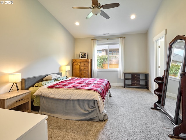 carpeted bedroom with lofted ceiling, recessed lighting, visible vents, and baseboards