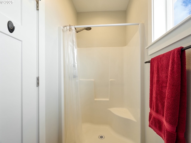 bathroom featuring a stall shower