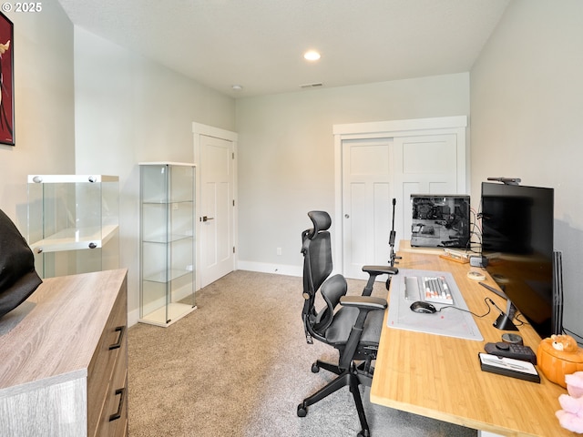 carpeted home office with baseboards, visible vents, and recessed lighting