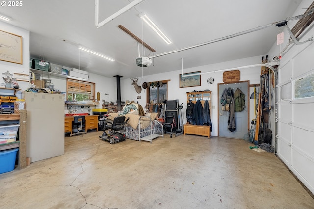 9065 Trask River Rd, Tillamook, OR 97141 - garage featuring a workshop area and a garage door opener