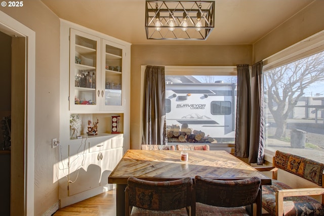 dining room featuring a healthy amount of sunlight and light wood-type flooring