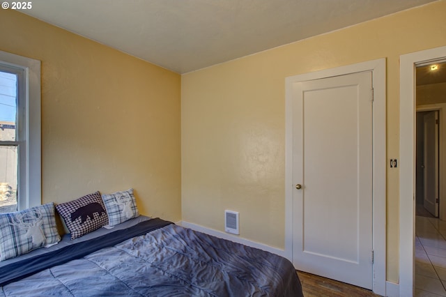 unfurnished bedroom with wood-type flooring