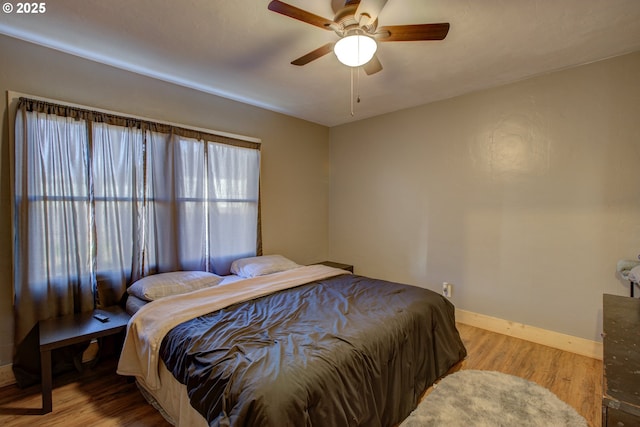 bedroom featuring ceiling fan and light hardwood / wood-style floors