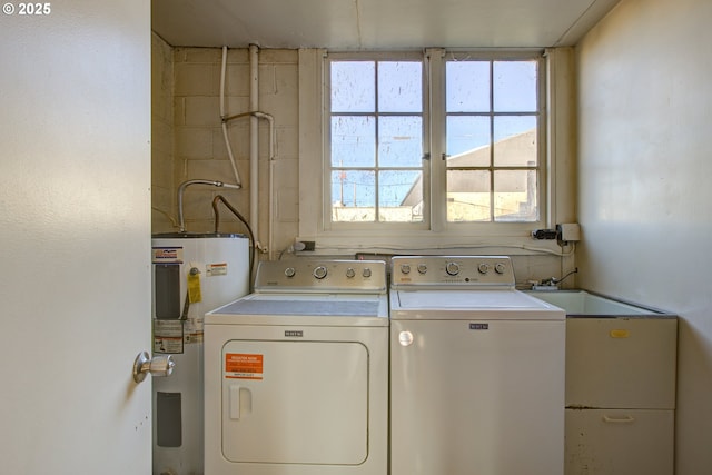 washroom featuring washer and dryer, sink, and electric water heater