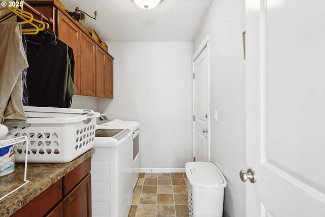 114 10th St, Jefferson, OR 97352 - washroom featuring cabinet space, separate washer and dryer, baseboards, and light stone finish floors