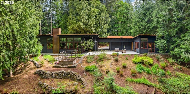 rear view of house with a patio area