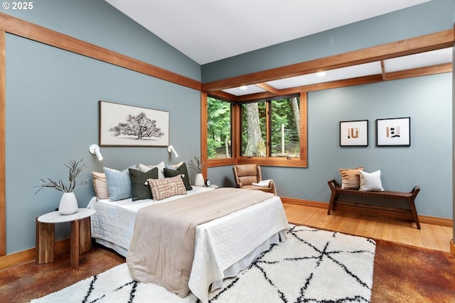 bedroom featuring baseboards, wood finished floors, vaulted ceiling, and recessed lighting