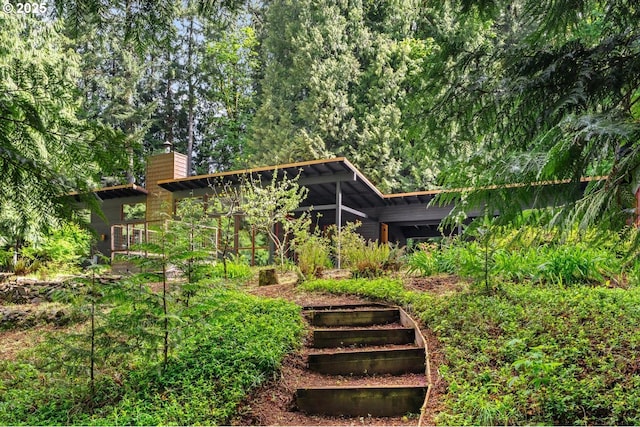 rear view of house with a chimney